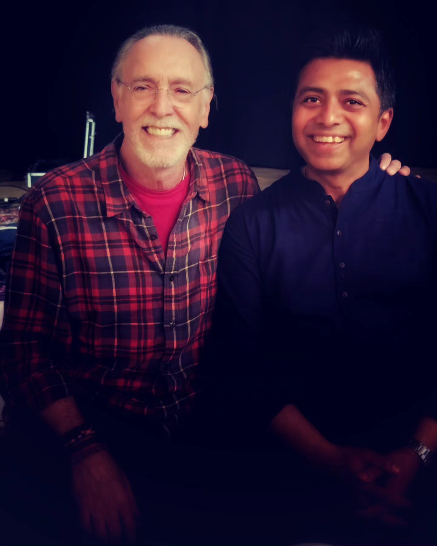 Shantonu Deva sharing a joyful moment with a fellow musician